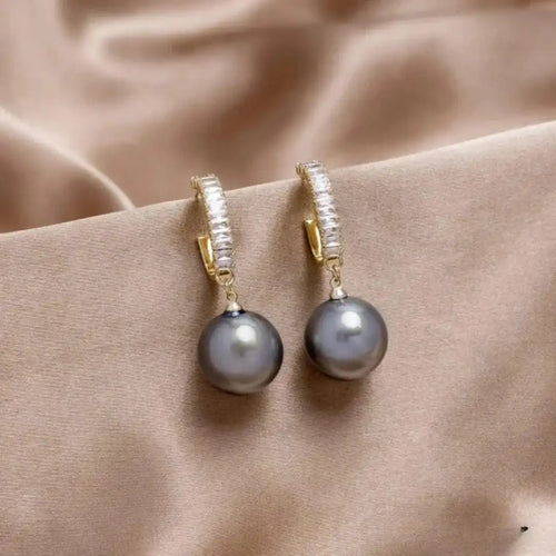 Elegante Ohrringe mit Perle und Zirkonia