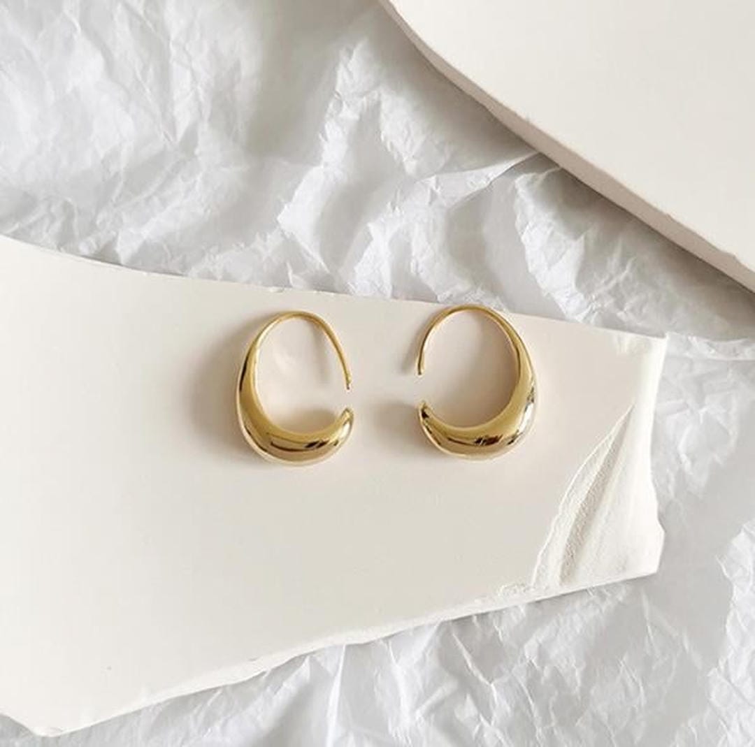 Ovale Hohrringe aus Gold und Silber