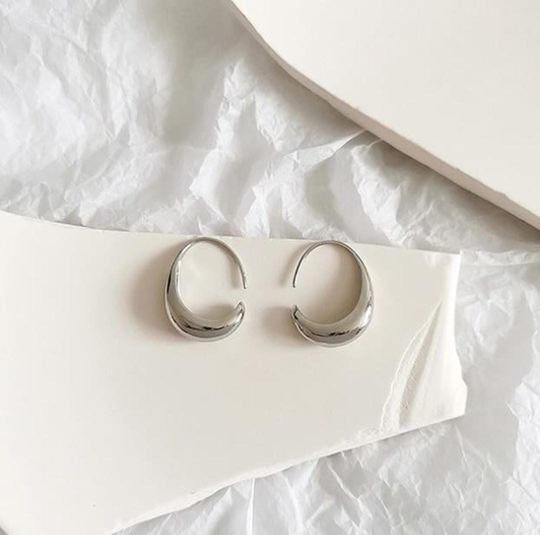 Ovale Hohrringe aus Gold und Silber