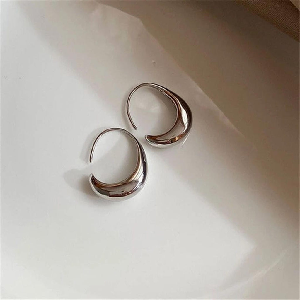 Ovale Hohrringe aus Gold und Silber
