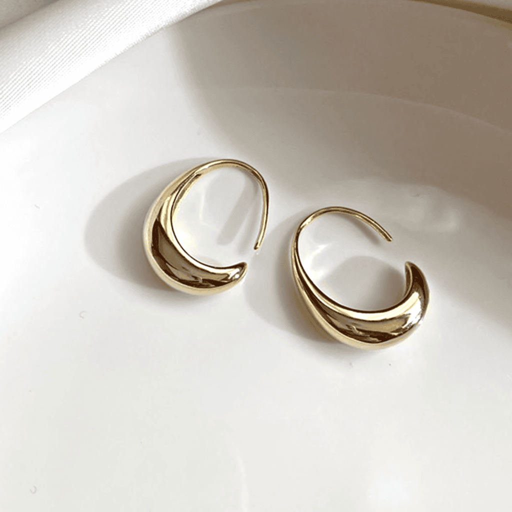 Ovale Hohrringe aus Gold und Silber
