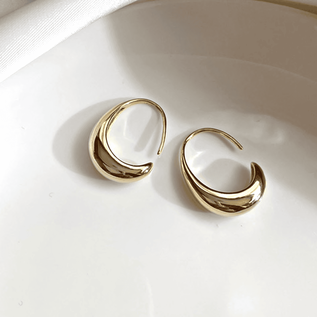 Ovale Hohrringe aus Gold und Silber